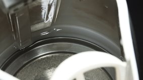 Close-up View of Pouring Water in Electric Kettle. 4K Ultra HD 3840x2160 Video Clip