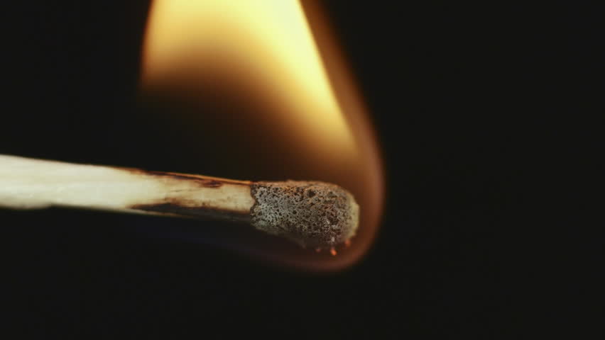 Match inginiting burning extreme macro close up background.
Macro extreme close up shot of a wooden match igniting after being heated up,and bursting into flames burning till the end.
