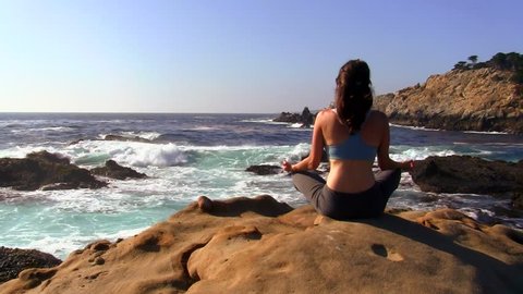 Yoga meditation on pristine beach 