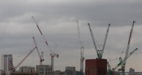 LONDON, ENGLAND - AUGUST 15, 2013 London City Building Under Construction Site Cranes Silhouettes Moving Cloudy ( Ultra High Definition, UltraHD, Ultra HD, UHD, 4K, 2160P, 4096x2160 )