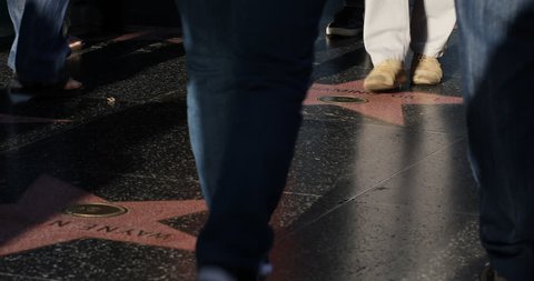 LOS ANGELES, USA - JUNE 18, 2013 Crowds People Walk Pass on LA Sidewalk, The Famous Hollywood Boulevard, Walk of Fame, Establishing Shot ( Ultra High Definition, Ultra HD, UHD, 4K, 2160P, 4096x2160 )
