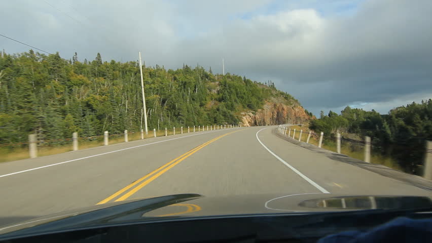 Driving in Northern Ontario. Evening sun on rockcut. Driving on HWY 17 north of Lake Superior in Northern Ontario, Canada.