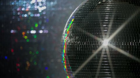 abstract funky discoball spinning with light effects and rays. perfect clip for club visuals or party/celebration
