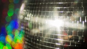 abstract funky discoball spinning with light effects and rays. perfect clip for club visuals or party/celebration
