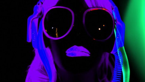 fantastic video of sexy cyber raver dancer babe filmed in fluorescent clothing under UV black light
