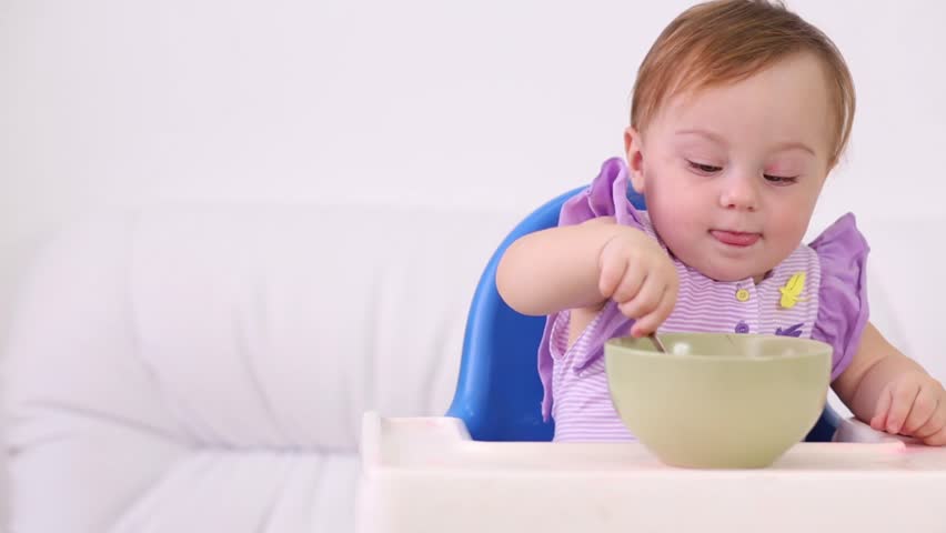 baby eating porridge