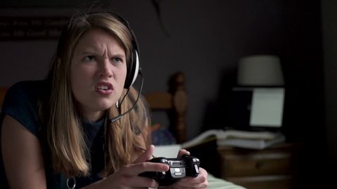 A woman is very angry and confused while playing a game in slow motion.