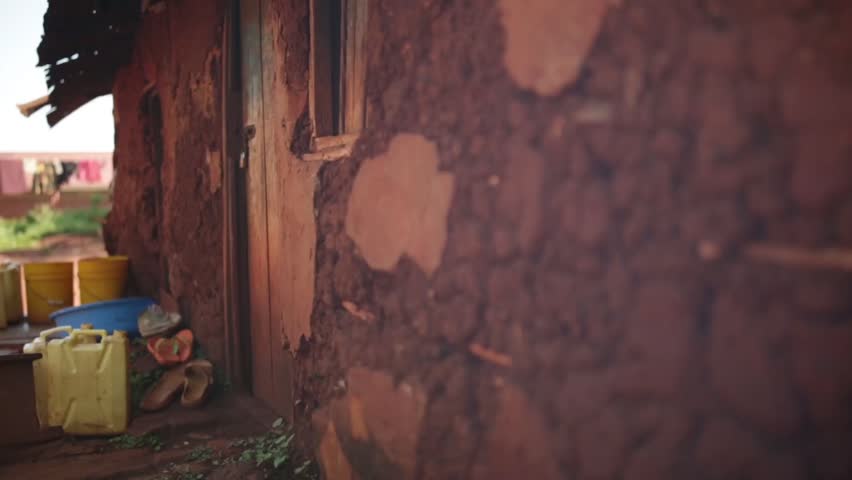 A traditional African hut mad from wood and mud in a slum in Uganda