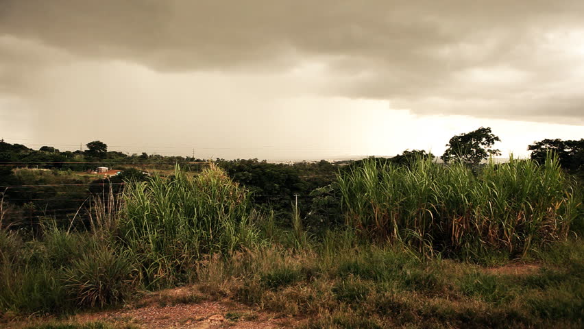 View on nature, sky and far away houses during a storm, thunder sound included /