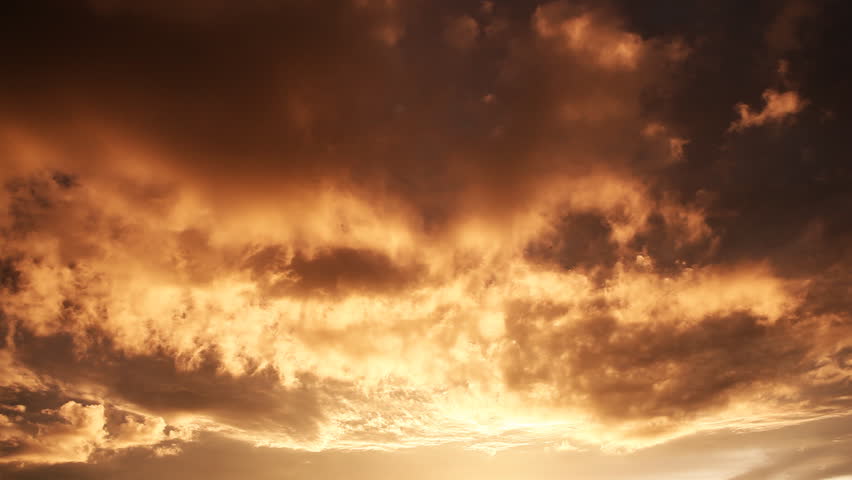 Clouds moving fast in vibrant red colors during sunset / HD1080 / 29.97fps