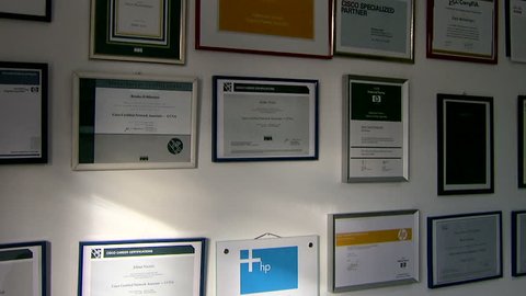 MONTENEGRO - PODGORICA 2009 - Office wall covered with diplomas