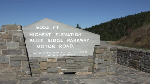 ASHEVILLE, NORTH CAROLINA/USA - OCTOBER 17, 2014: Highest elevation sign post on Blue Ridge Parkway road. Construction of the parkway took over 52 years to complete.