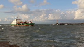 ship going into Baltic Sea wave Ventspils harbour Latvia video