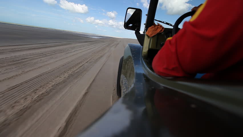 Though ride through sand dunes with a buggy, viewed from vehicle
