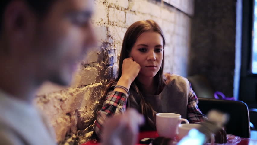 Young bored couple with smartphone sitting in cafe
 Royalty-Free Stock Footage #8389021