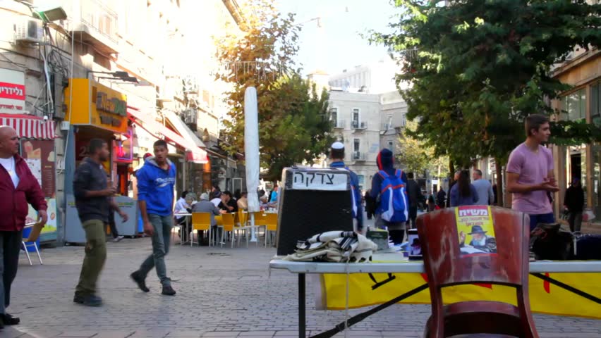 JERUSALEM, ISRAEL - NOVEMBER 18: Photographer and visitors  in Ben Yehuda Street at ordinary evening  on November 18, 2014 in Jerusalem, Israel. , It