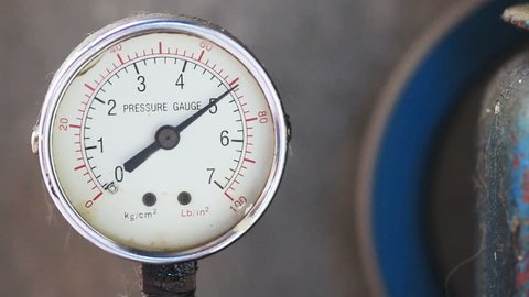 Close up pressure gauge with compressor working.