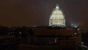 Timelapse of the United States Capitol building at night under renovation