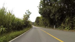 Driving through the country road on mountain.  HD