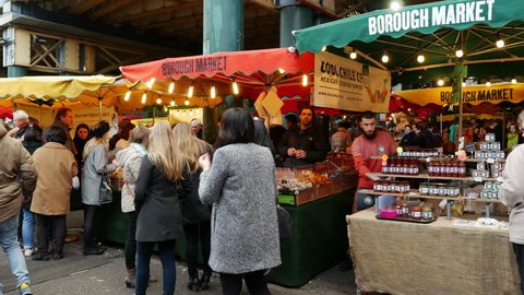 London, England/United Kingdom - December 2014. Market-Goers amongst the Food Maket Stalls in Borough Food Market, Southwark, London, United Kingdom