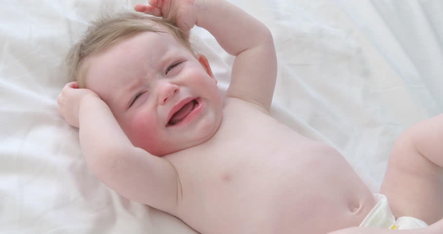 Baby boy crying lying on his back Royalty-Free Stock Footage #8421190