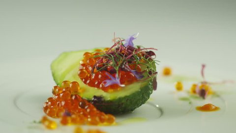 Garnish Red Salmon Caviar with Avocado and Olive Oil in Luxury Restaurant
Shot on RED Cinema Camera in 4K (UHD).
ProRes codec - Great for editing, color correction and grading. స్టాక్ వీడియో