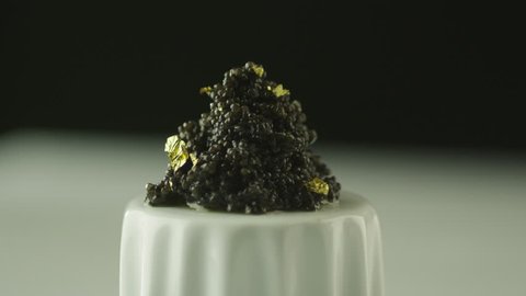Professional Cook Garnish Black Caviar with Gold in Luxury Restaurant.
Shot on RED Cinema Camera in 4K (UHD).
ProRes codec - Great for editing, color correction and grading.
