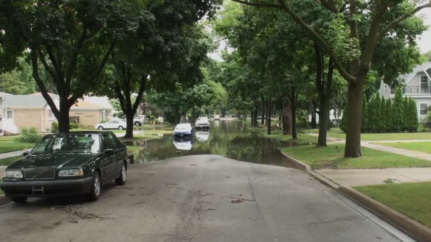 Des Plaines, Illinois USA 2011-07-23. After heavy rainfall Des Plaines  River level rose very quickly and eventually overflowed, flooding many streets and houses.