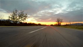 Sport car race with fast motion speed. 4k shoot. Asphalt POV - Point of View, sunrise, sunset 