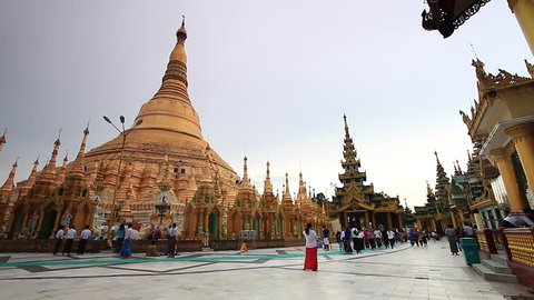 YANGON, MYANMAR- AUGUST 17 : Tourists visit the Shwedagon Pagoda in Yangon on August 17, 2014. Yangon Myanmar 
