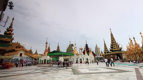 YANGON, MYANMAR- AUGUST 17 : Tourists visit the Shwedagon Pagoda in Yangon on August 17, 2014. Yangon Myanmar 