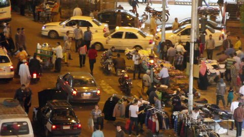 CAIRO, EGYPT - NOVEMBER 17, 2012: Wide shot of street vendors and traffic. 1080p HD with natural sound.