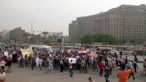CAIRO, EGYPT - NOVEMBER 16, 2012: Egyptian protestors march down a street. 1080p HD with natural audio.