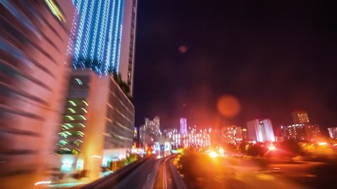 MIAMI, FLORIDA USA - DECEMBER 11, 2014: The automated Miami Metromover rides through Downtown Miami at night. Point of view time-lapse through downtown Miami. 