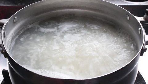 rice over boiling in pot