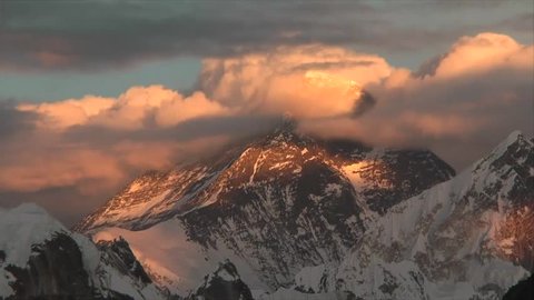 Everest in the clouds during sunset
