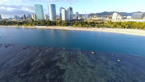 Aerial video over Ala Moana Beach Park, shopping center, and Magic Island and Ala Wai Boat Harbor in Honolulu, Hawaii near Waikiki