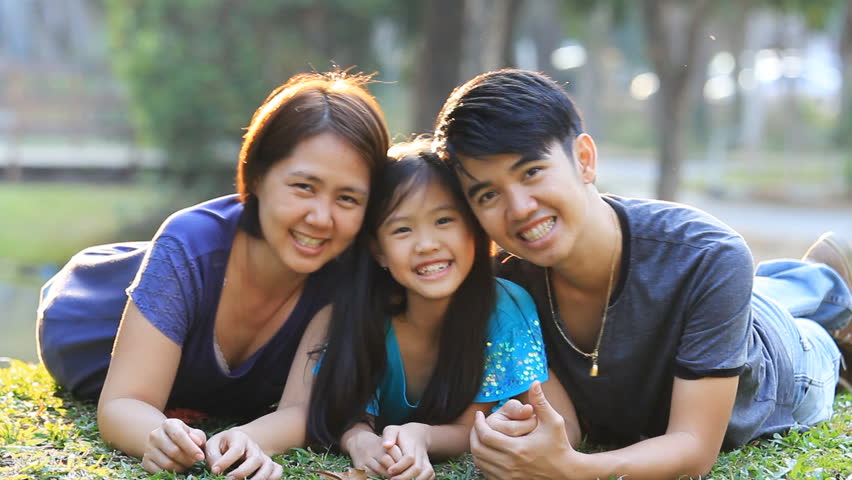 happy asian family playing together park Stock Footage Video (100%