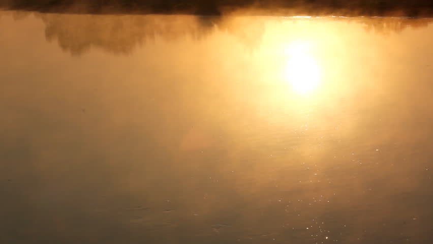 sunrise reflection in the river with mist