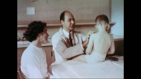 UNITED STATES 1950s-1960s : A doctor examines a boy as children learn in a special classroom and a man gets a chest x-ray.