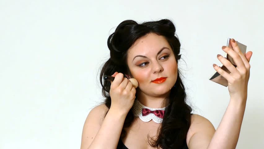 Pretty brunette girl posing like Marilyn Monroe with red lips