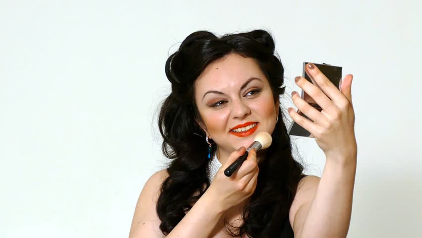 Pretty brunette girl posing like Marilyn Monroe with red lips