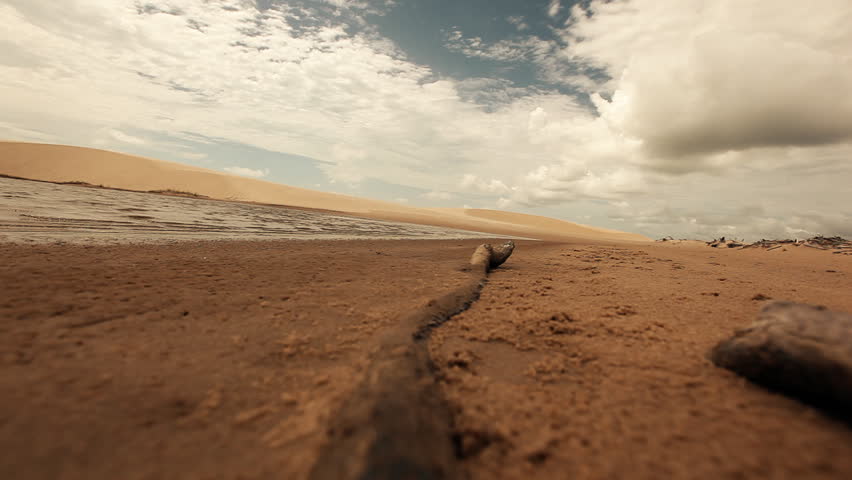 Deserted landscape shot from a very low angle with a stick in the foreground and