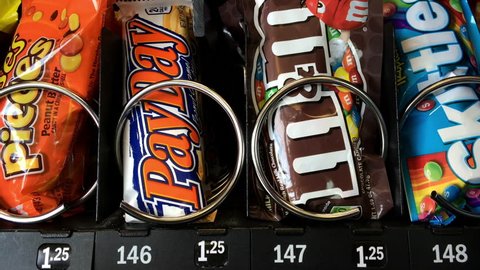 USA - CIRCA 2014: Chocolate M & M candy purchased from vending machine.