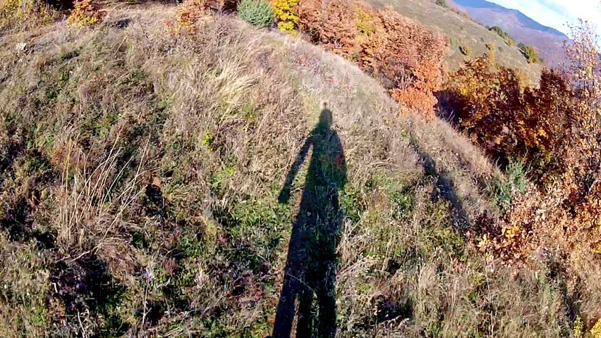 Cyclist riding down a difficult track. Cycling track.pov