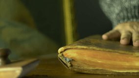 4K UHD Stock footage Discovering an Ancient Book