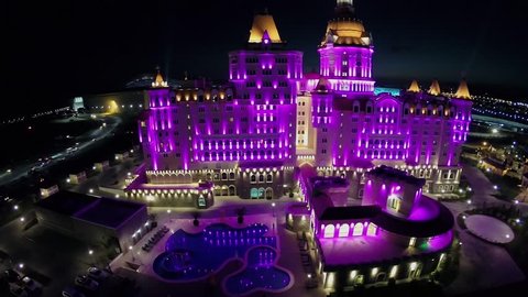 SOCHI - JUL 27, 2014: Bogatyr hotel complex with color light and amusement park at summer night. Aerial view. 3.7 million travellers visited town resort Sochi from january to august 2014.