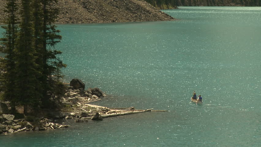 Couple canoeing on Moraine Lake in the Canadian Rockies