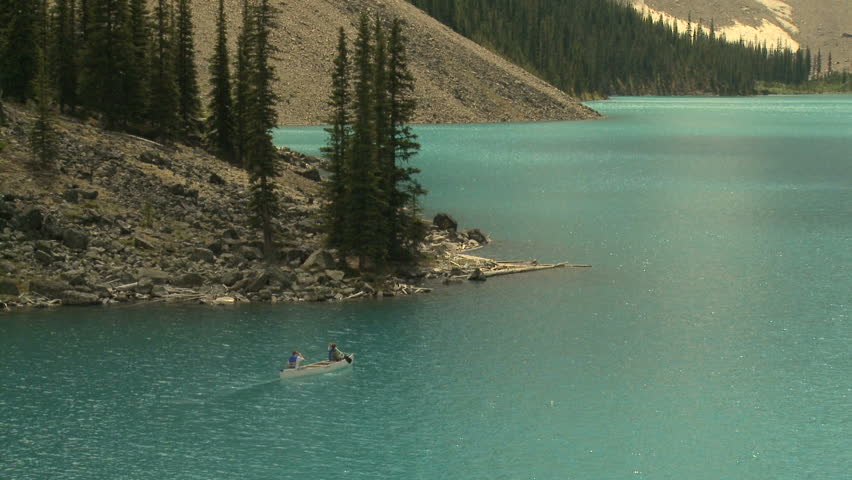 Couple canoeing on Moraine Lake in the Canadian Rockies