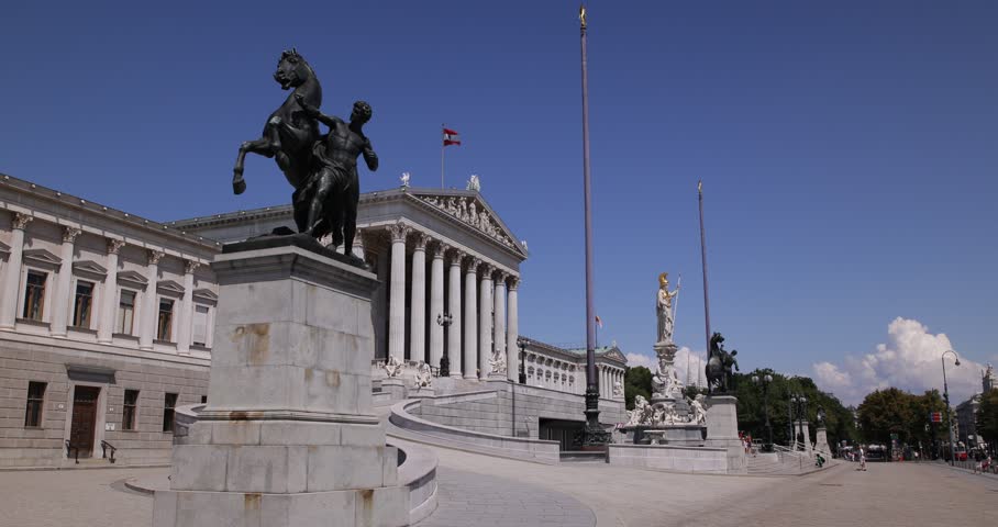 Vienna Austrian Parliament Establishing Shot Busy Street Sidewalk People Walking ( Ultra High Definition, UltraHD, Ultra HD, UHD, 4K, 2160P, 4096x2160 )